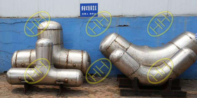 Stainless steel pipe fittings after burst proof testing